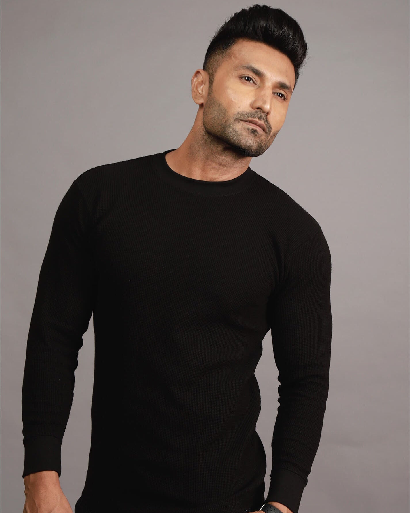 Man wearing a black long-sleeve shirt ag